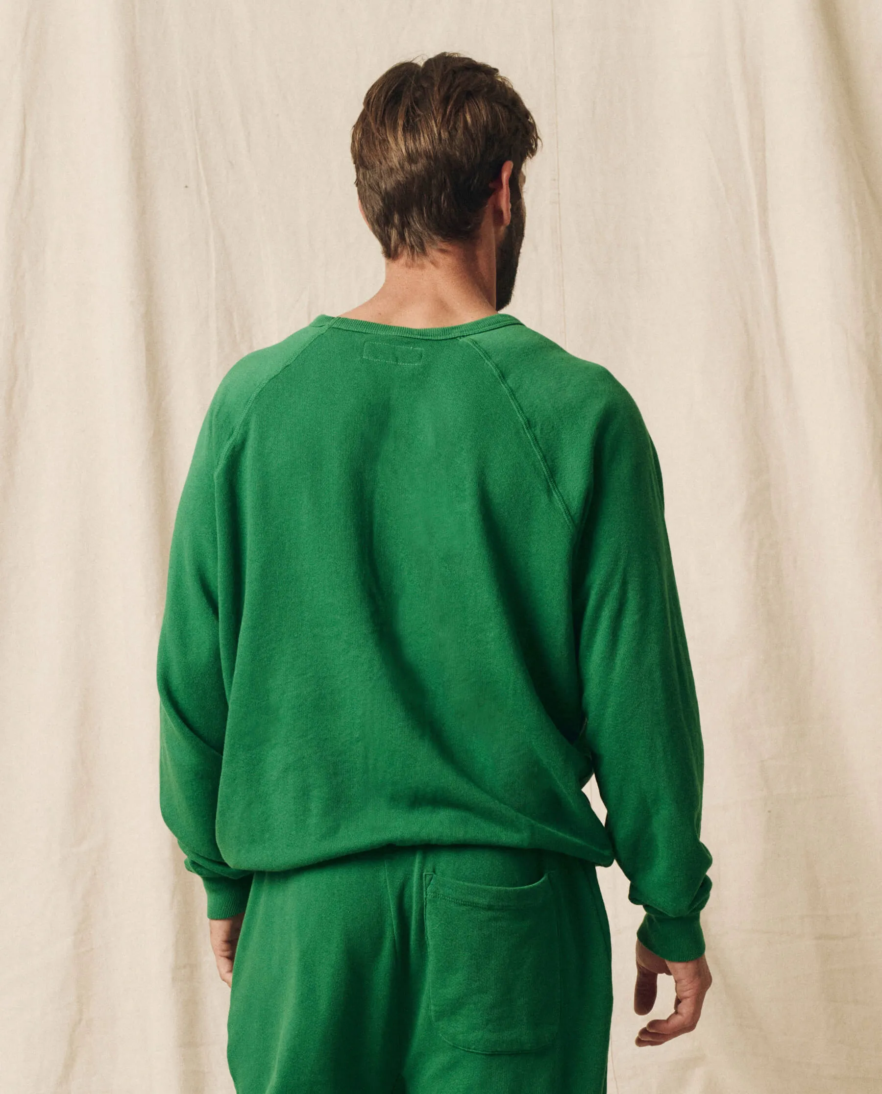 The Men's College Sweatshirt. Solid -- Holly Leaf
